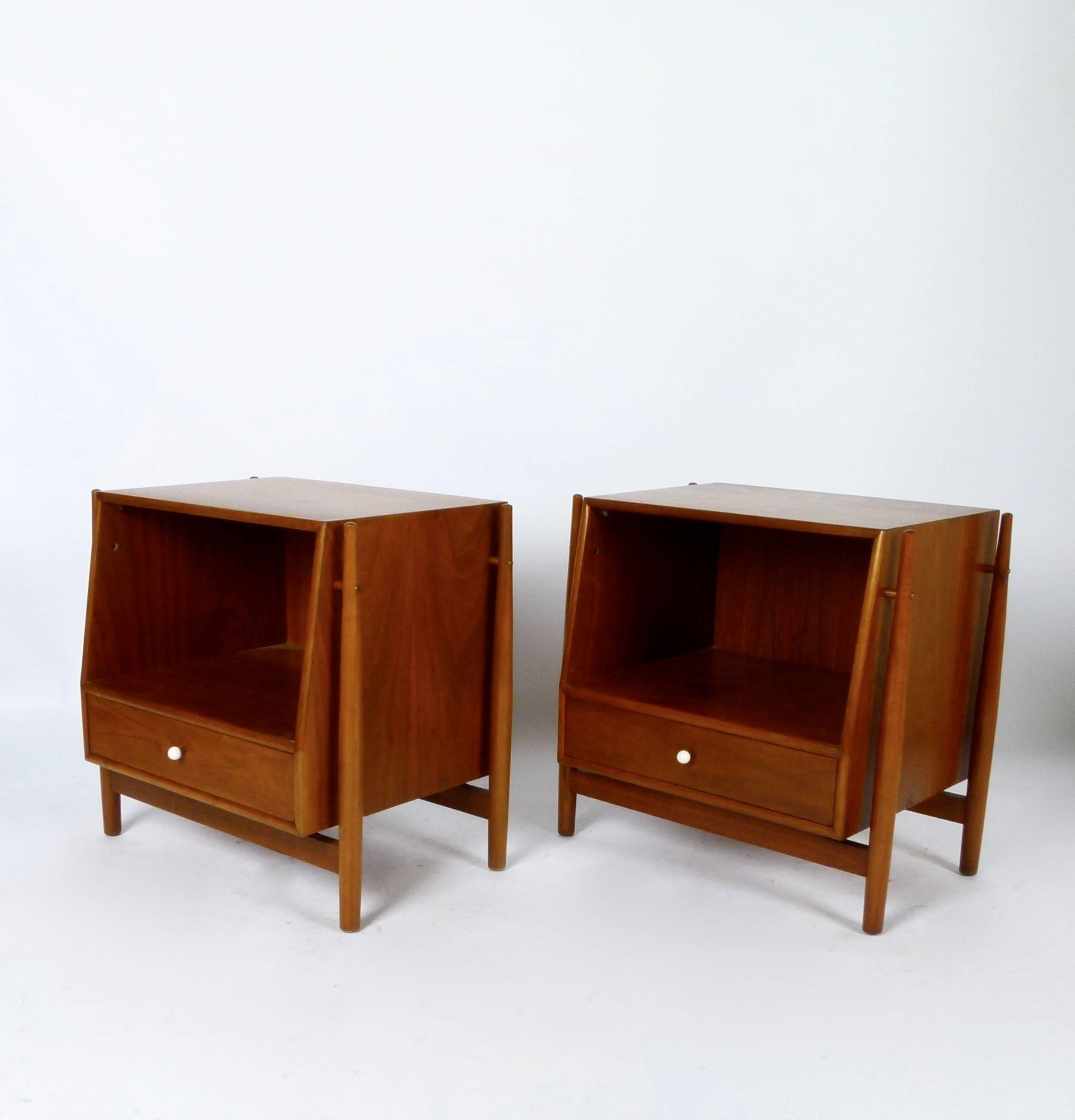 Pair of 1965 one drawer nightstands in walnut with porcelain pulls by Kipp Stewart for Drexel's Declaration line.