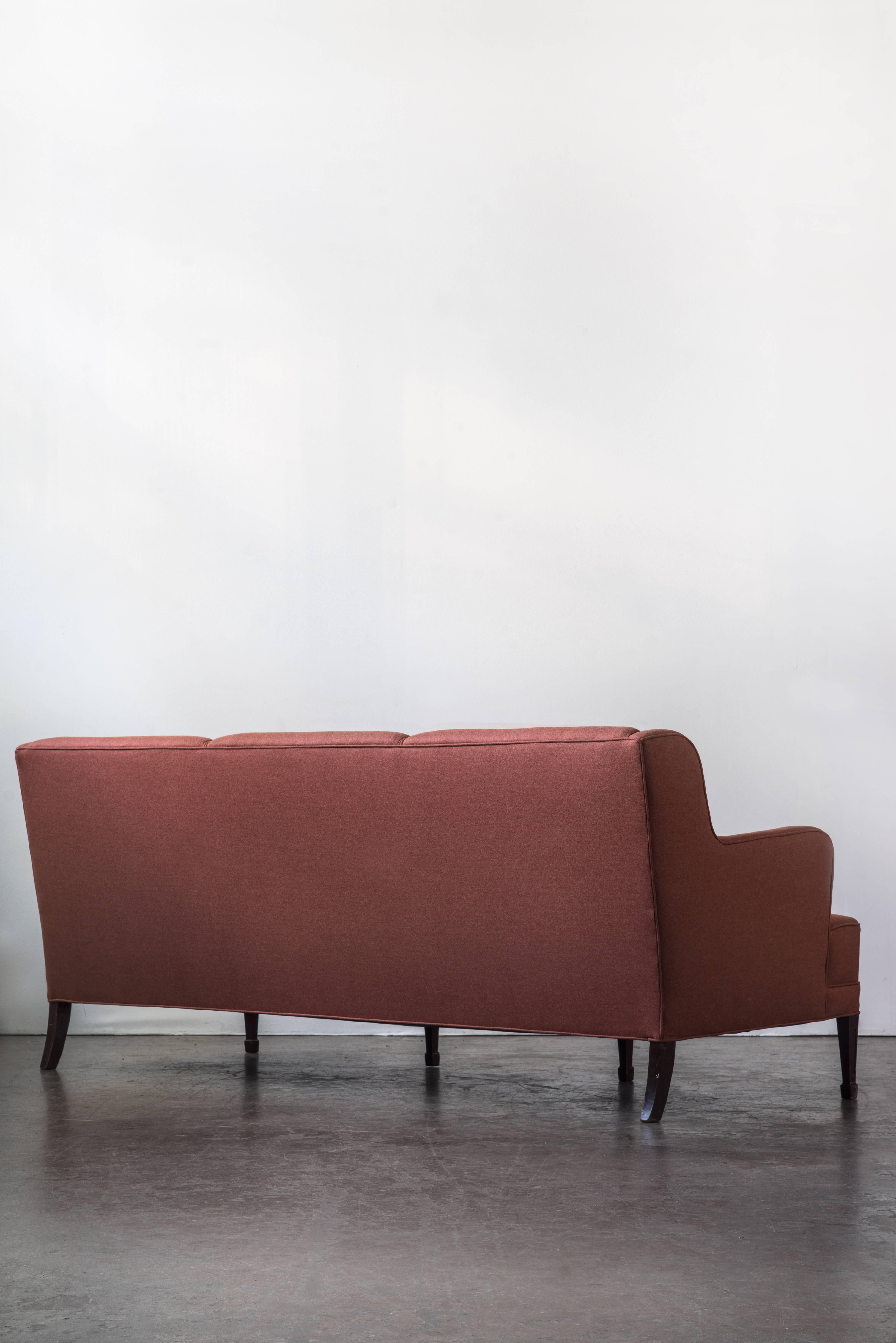 A newly upholstered classic three-seat sofa by Frits Henningsen with mahogany legs. Re-Upholstered by ASH NYC in a beautiful wool from Fortuny.
