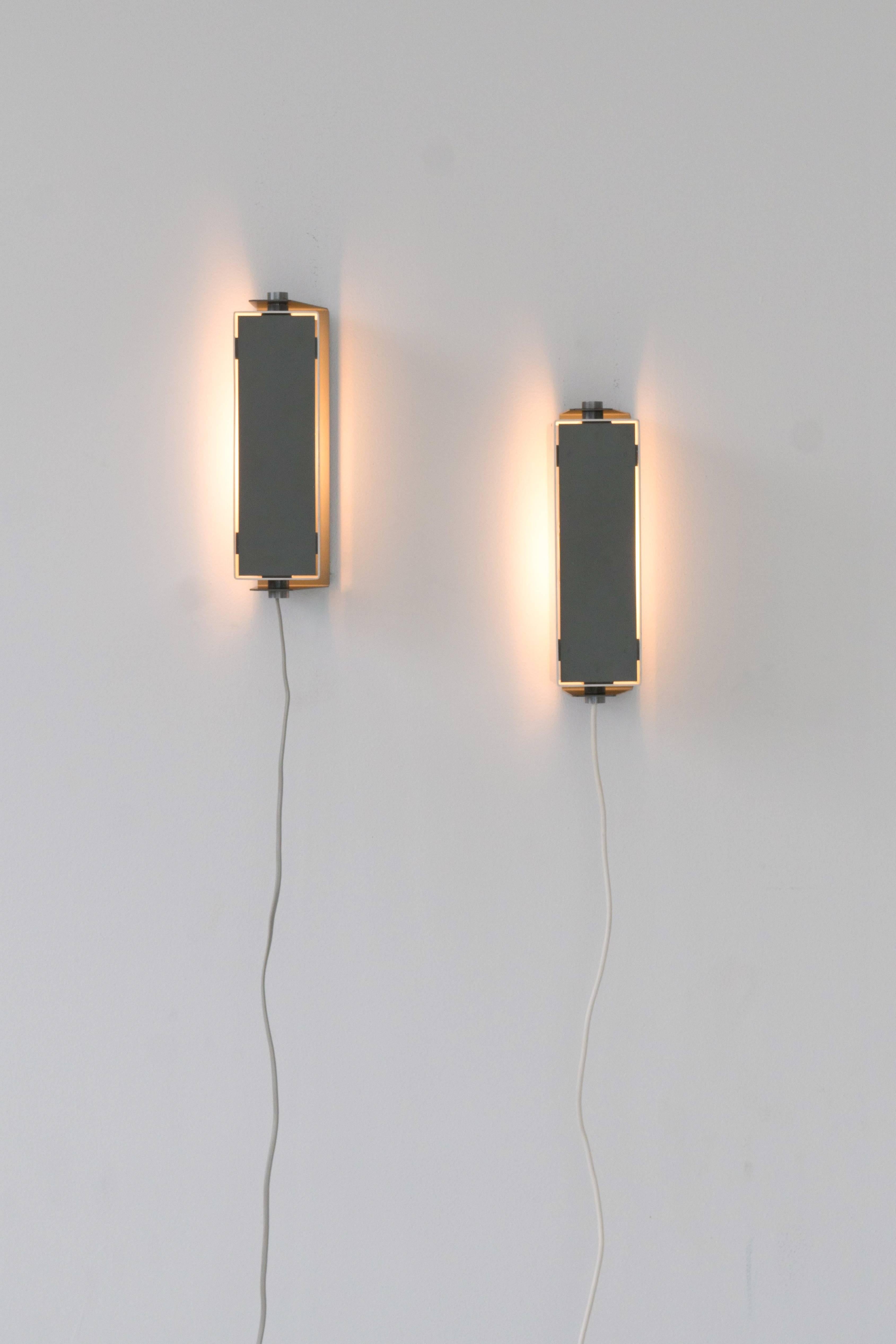 Rare Jo Hammerborg rotating lacquered metal and brushed aluminium wall sconces.