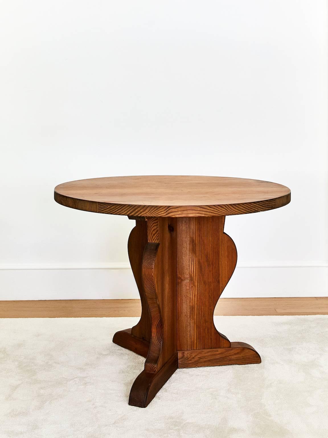Solid pine table designed by Axel Einar Hjorth and produced for Stockholm department store Nordiska Kompaniet in the 1930s. 

He was the store's chief interior architect. The tables are quite rare and ended up being produced in a small quantity as