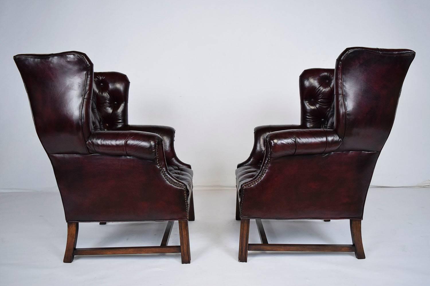North American Pair of Chesterfield Tufted Leather Wingback Chairs