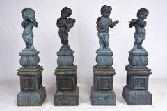 Set of Four Neoclassical-Style Cast Iron Garden Statues