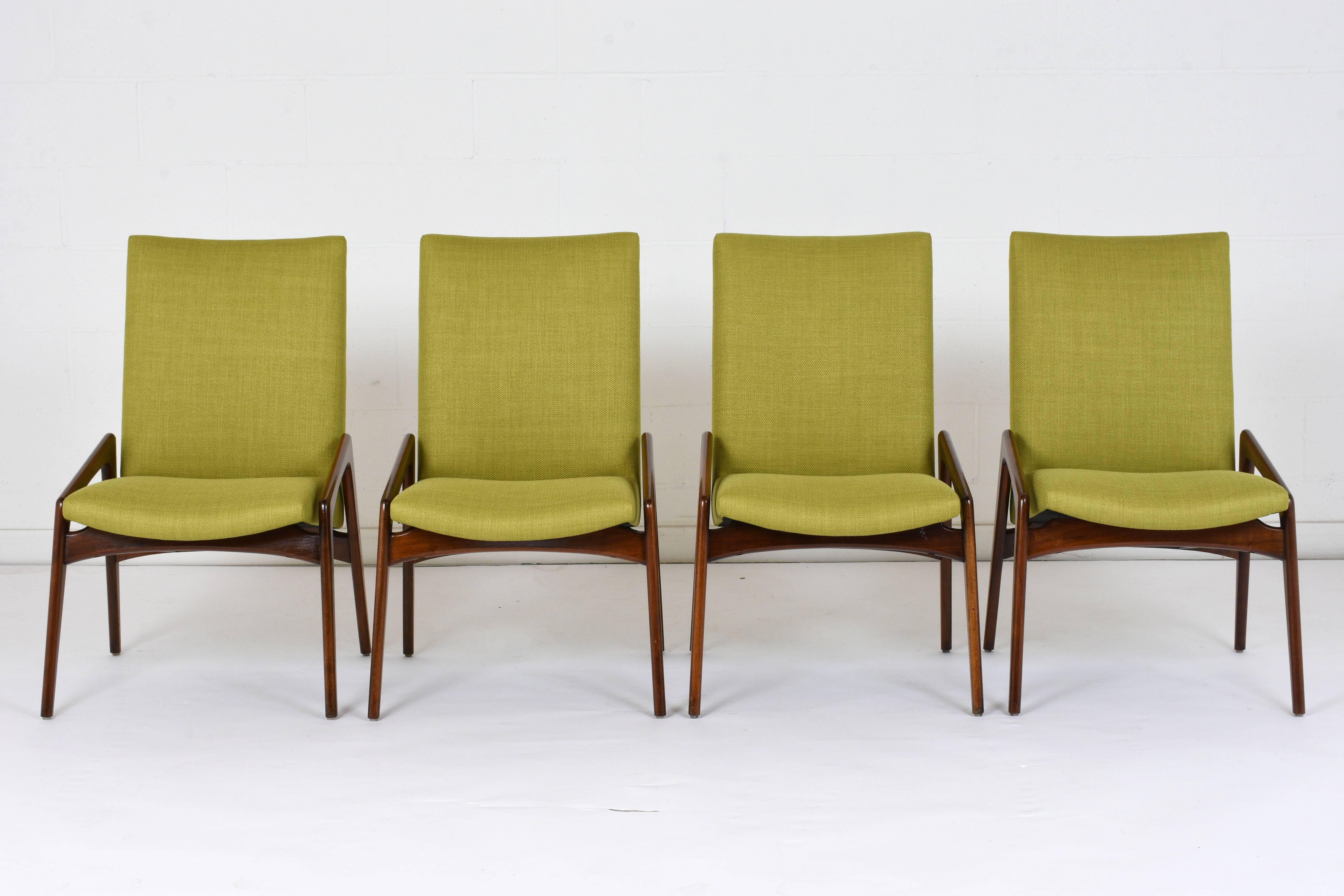 This set of four 1960s Danish Mid-Century Modern style dining chairs are designed by Kai Kristiansen. The geometric teak wood frames are finished in a walnut color with a lacquered finish. The seats have recently been professionally upholstered in a