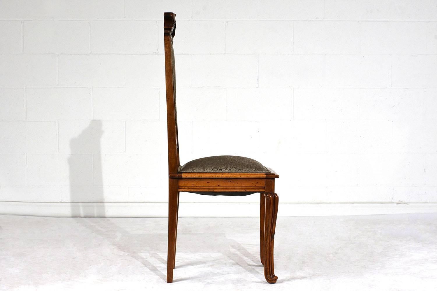 This rare 1900s Art Nouveau side chair is made is made in the manner of Louis Majorelle. The side chair features a frame made of walnut wood in its original walnut color stain and has recently been polished and waxed. This chair frame is adorned
