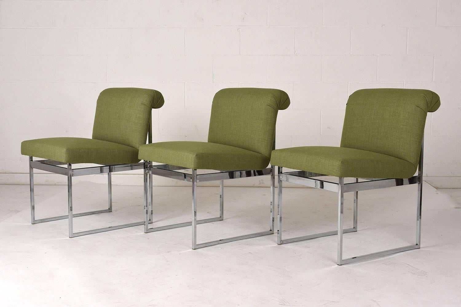 This set of six 1960s Mid-Century Modern style dining chairs are in the style of Milo Baughman. The chairs have a simple geometric chrome frame that pairs well with the upholstered seat. The seat has a unique shape with a scroll curved back and a