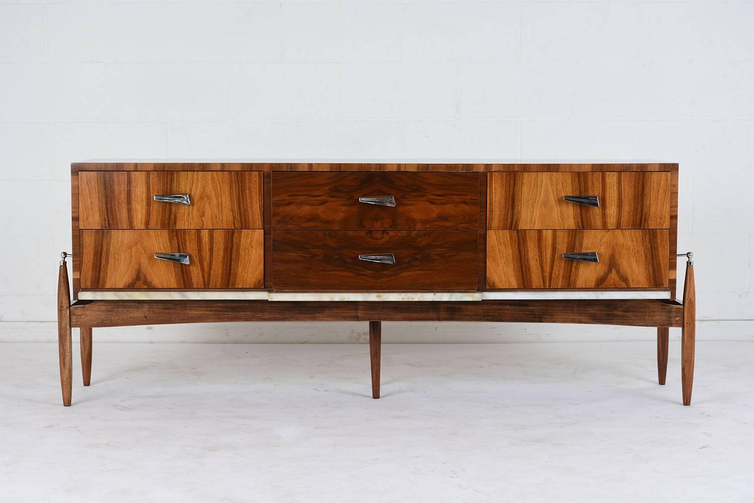 This pair of Mid-Century Modern style credenzas is made from walnut wood finished in rich walnut color stain with stunning wood grain and newly lacquered finish. Each credenza has six drawers with geometric steel pulls. Below the drawers is a white