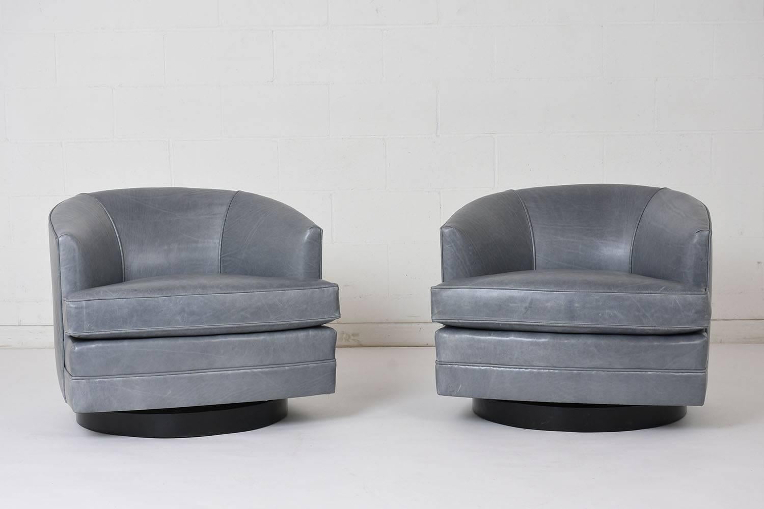 African Pair of Mid-Century Modern Style Leather Swivel Lounge Chairs