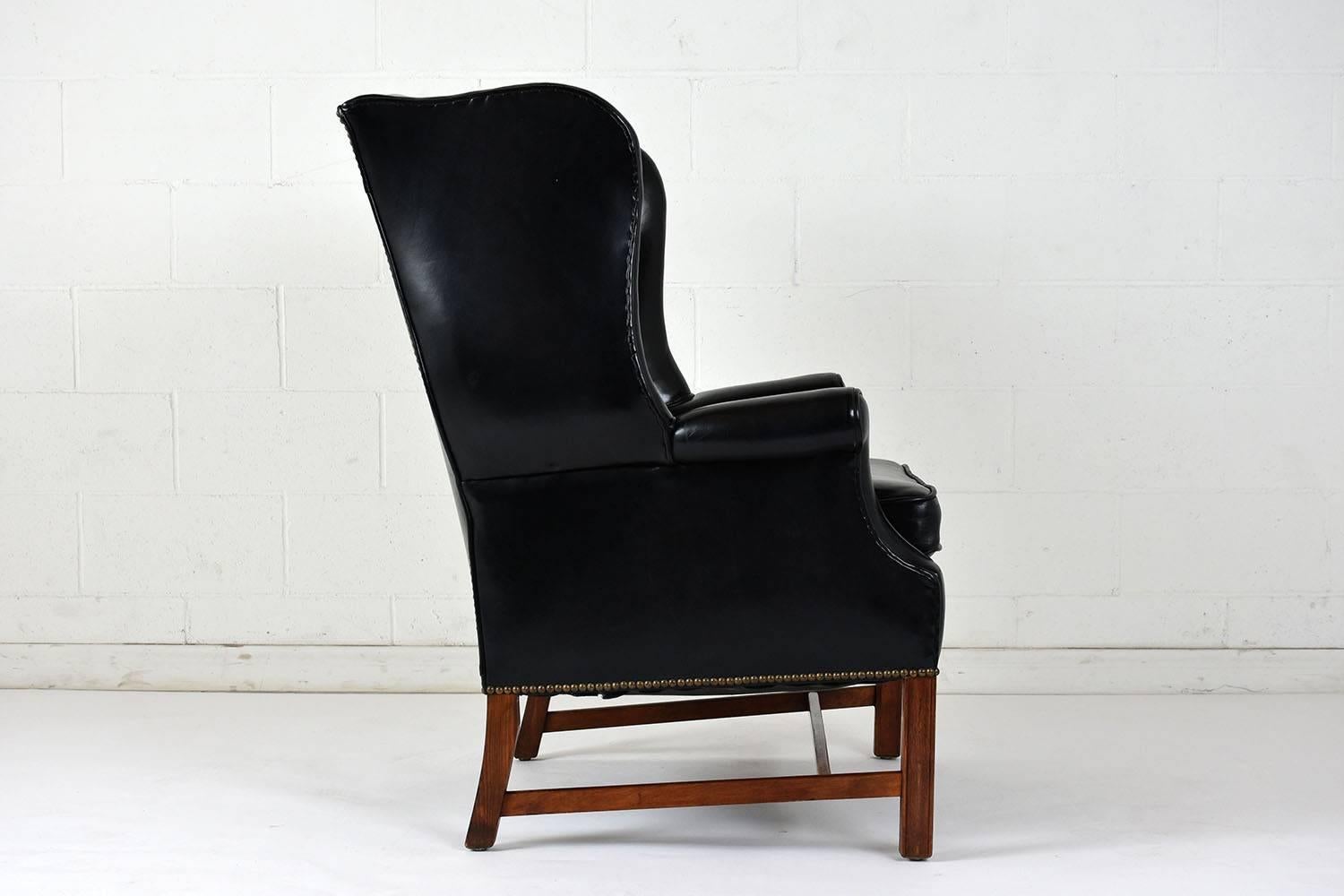 Carved Early 20th Century English Regency-style Wingback Leather Chair
