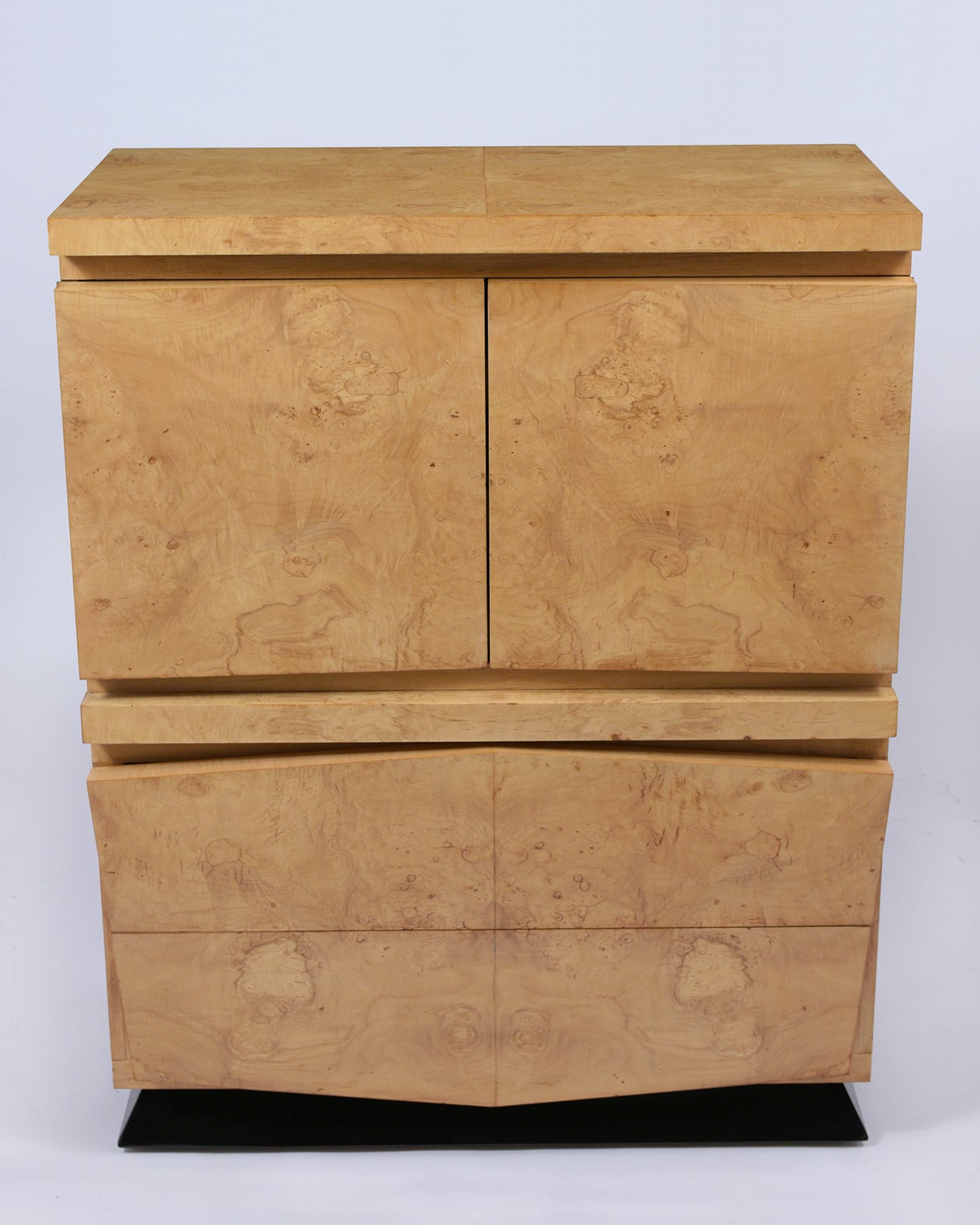 Step into the world of mid-century design with our newly restored Chest of Drawers, a testament to exquisite craftsmanship and unique style. Expertly crafted from maple wood, this dresser is adorned with exotic bird-eye burled veneers, giving it a
