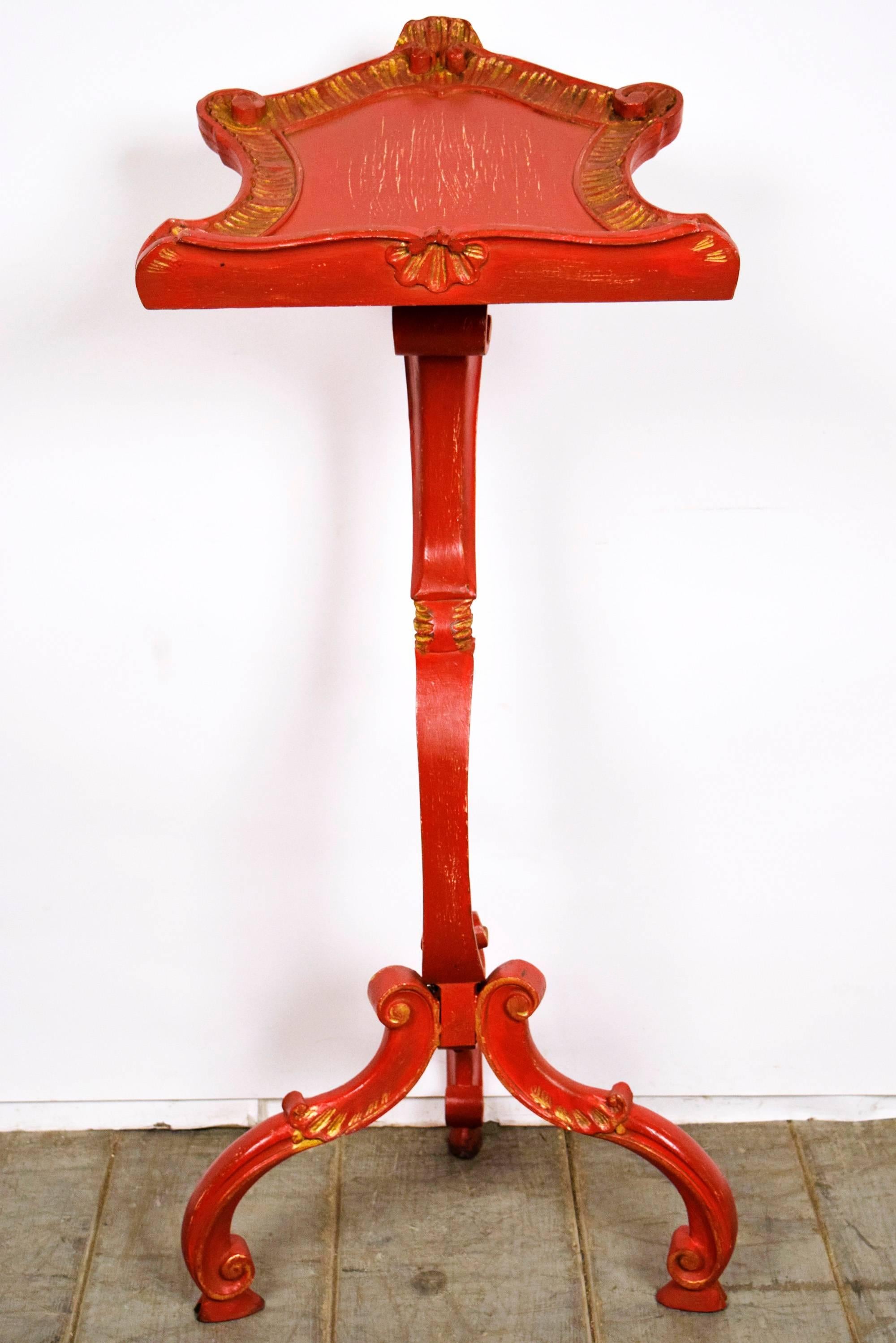 This is a mesmerizing Antique Venetian Polychromed and Gilt wood music stand. It has intricately carved curved legs in the bottom with gilt accents. It has a heavy duty sculpted wood post which is both elegantly decorative and strongly supportive.