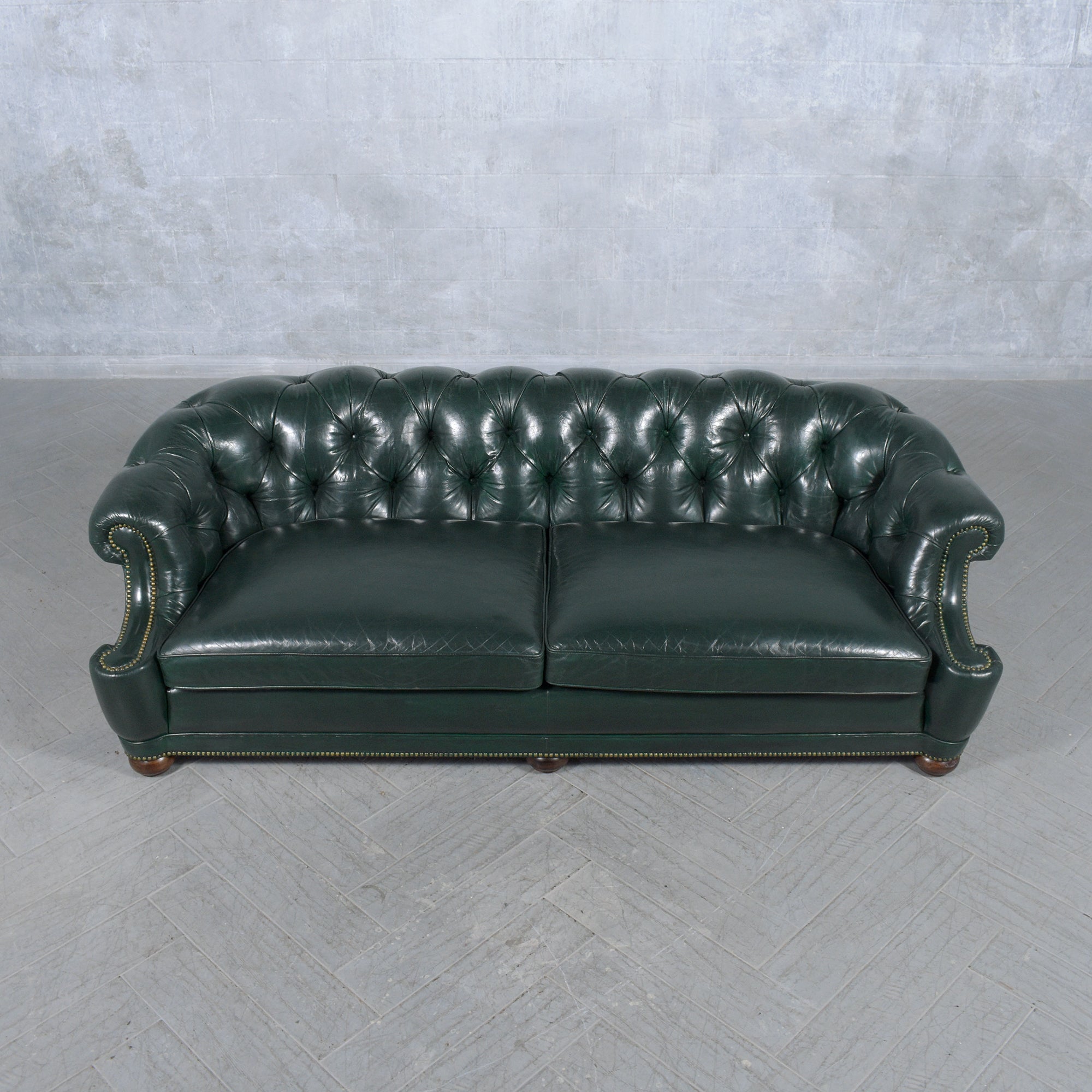 Discover the timeless luxury of our 1970s Italian Chesterfield Sofa, a vintage masterpiece revitalized for the modern era. Our skilled craftsmen have meticulously restored this sofa, blending its classic allure with contemporary style. Made from