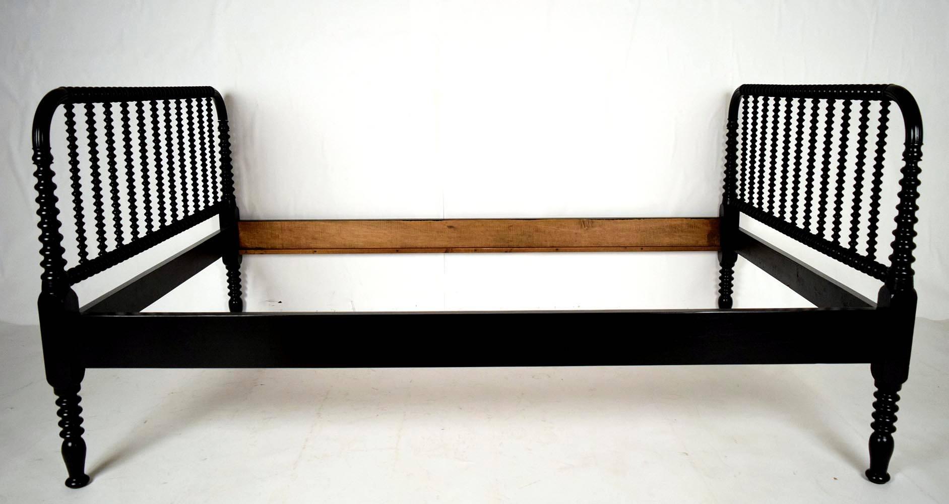 This is a beautiful 1890s spool daybed frame. Solid mahogany wood, newly painted in a rich black color with a deep lacquered finish. Amazingly carved headboards and legs. Frame is solid and sturdy ready to be used.

Inside dimensions: 50