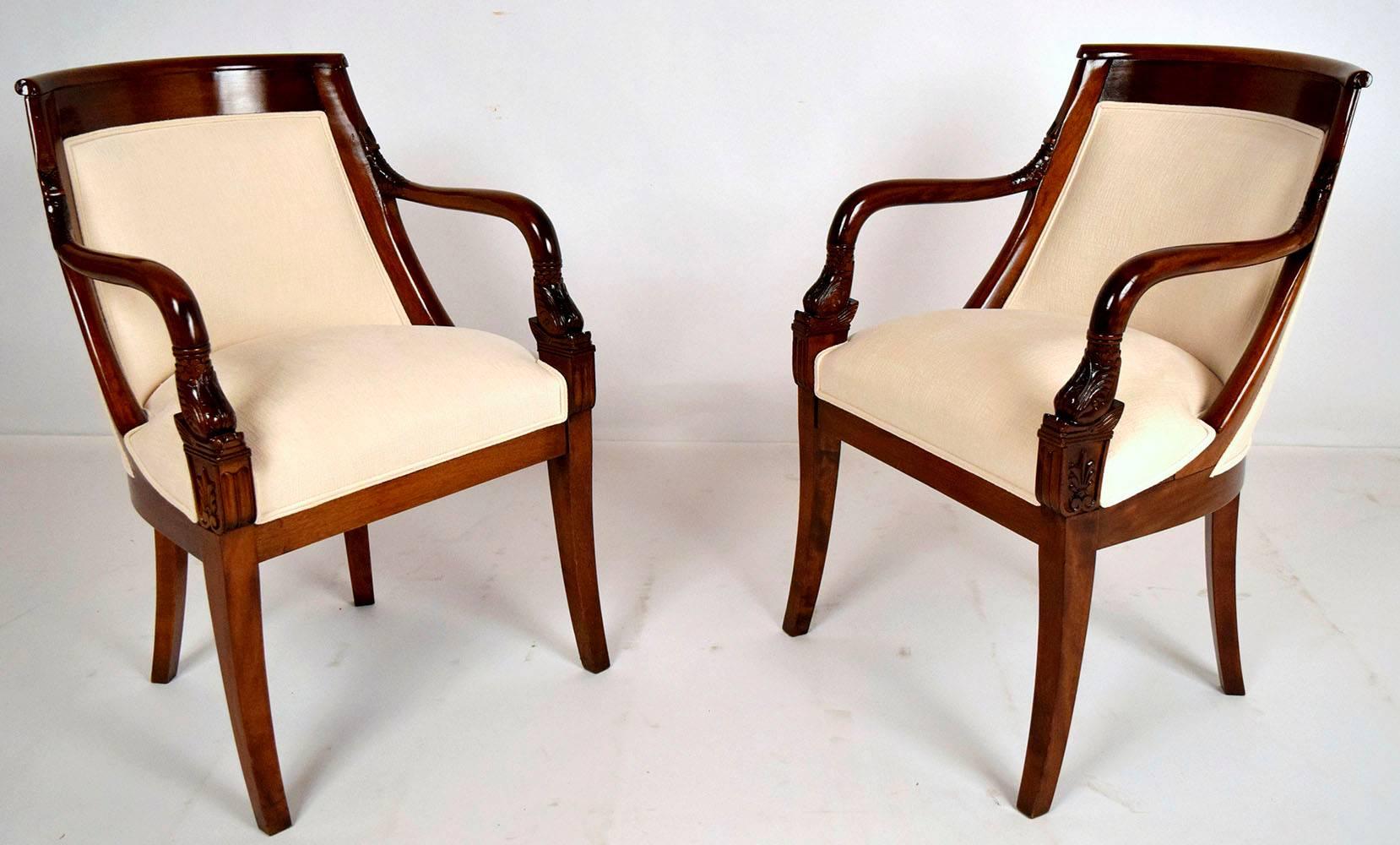 Beautiful set of eight, 1900s dining chairs Empire style set has two armchairs and six side chairs. Solid gondola mahogany wood frames, finished in a rich dark mahogany. All chairs have curved backs, and the two armchairs have carved arms. All eight