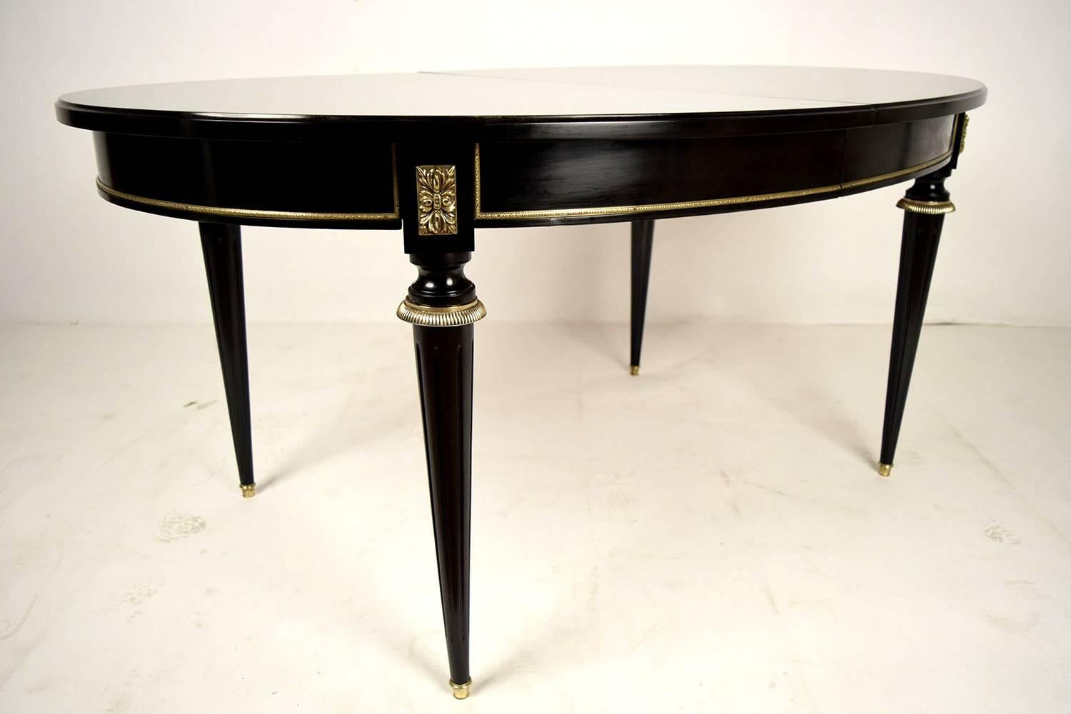 Carved French Louis XVI-style Ebonized Oval Dining Table