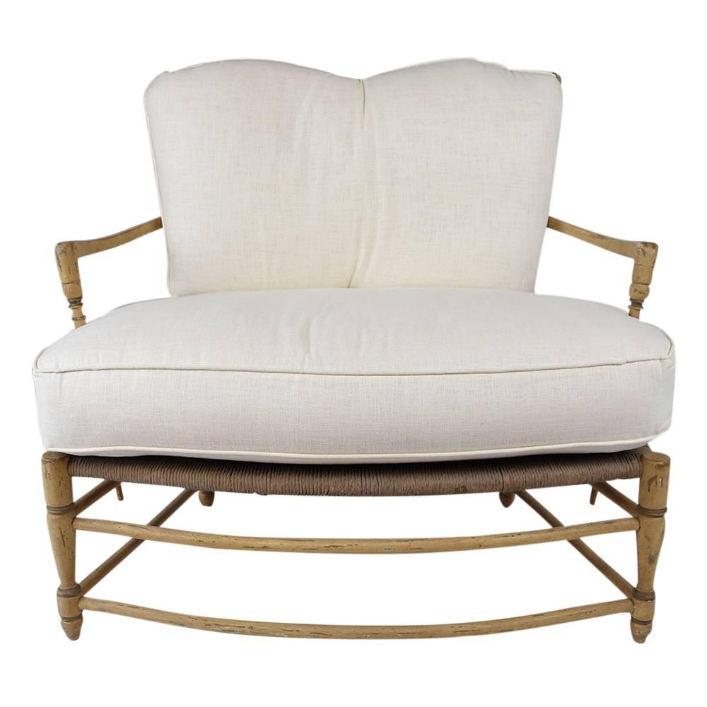 This 1970s Vintage French Provincials-style pair of settees feature a carved wood frame with its original color and painted details. The back features a ladder design with rush seats. The legs and arms features carved spindle details and the legs