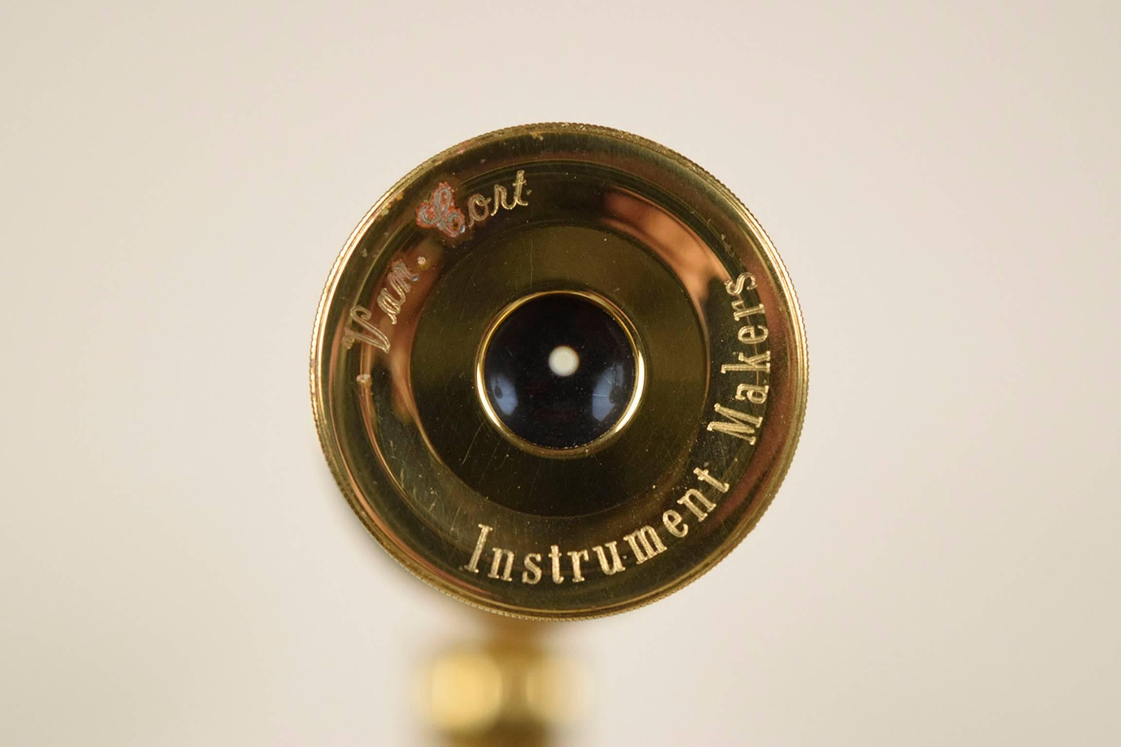 This is a 1970s Van Cort Instrument Makers Telescope. The telescope and mid section are crafted from brass and sits upon a tripod made from wood finished in a mahogany color stain. This instrument to see the stars of our universe is ready to be used