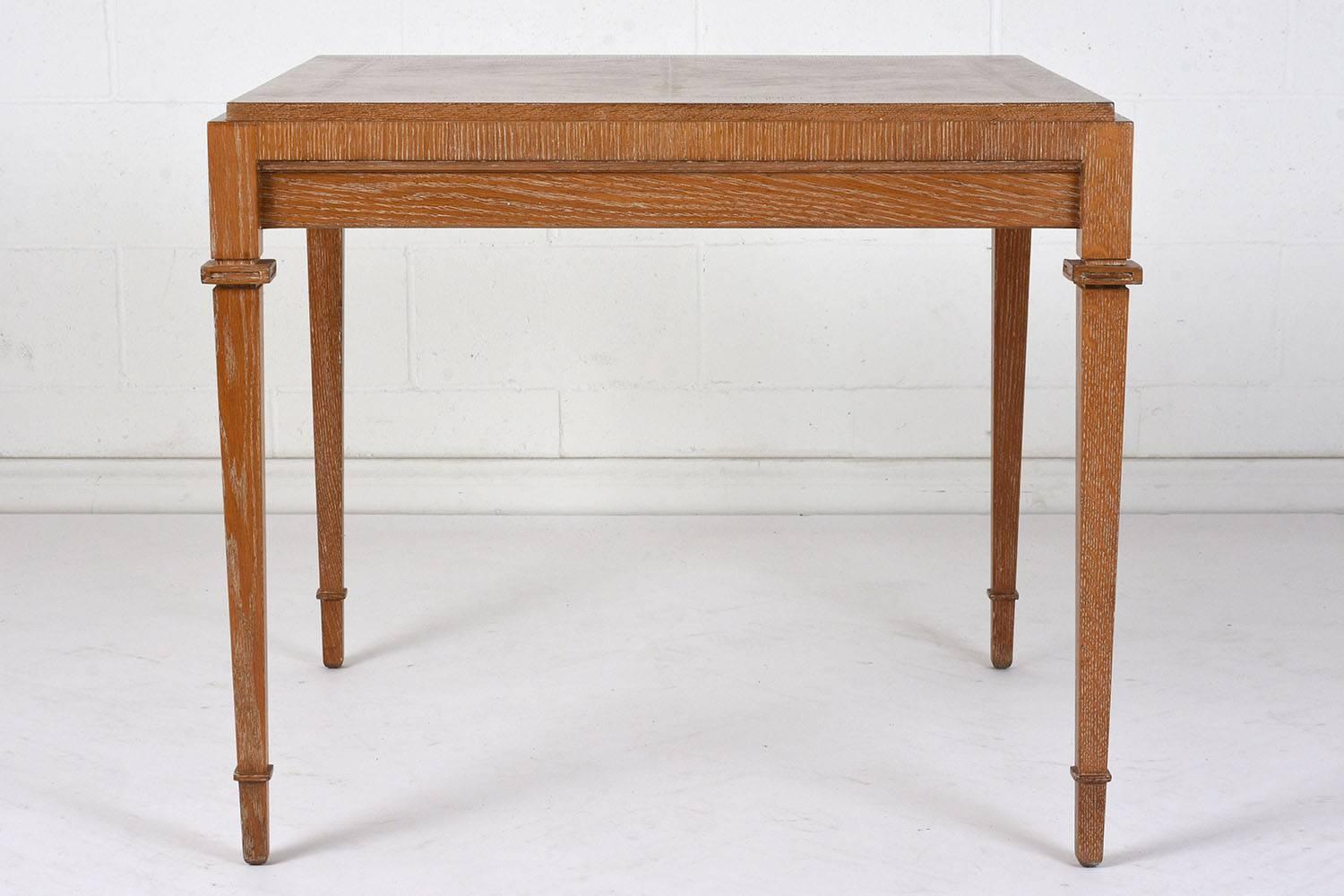 This 1960s modern style game table is made of ashwood with a white wash finish and parquetry details. The table have geometric parquetry details on the top. The tapered legs have carved bands at the top and bottom. The table can be converted three