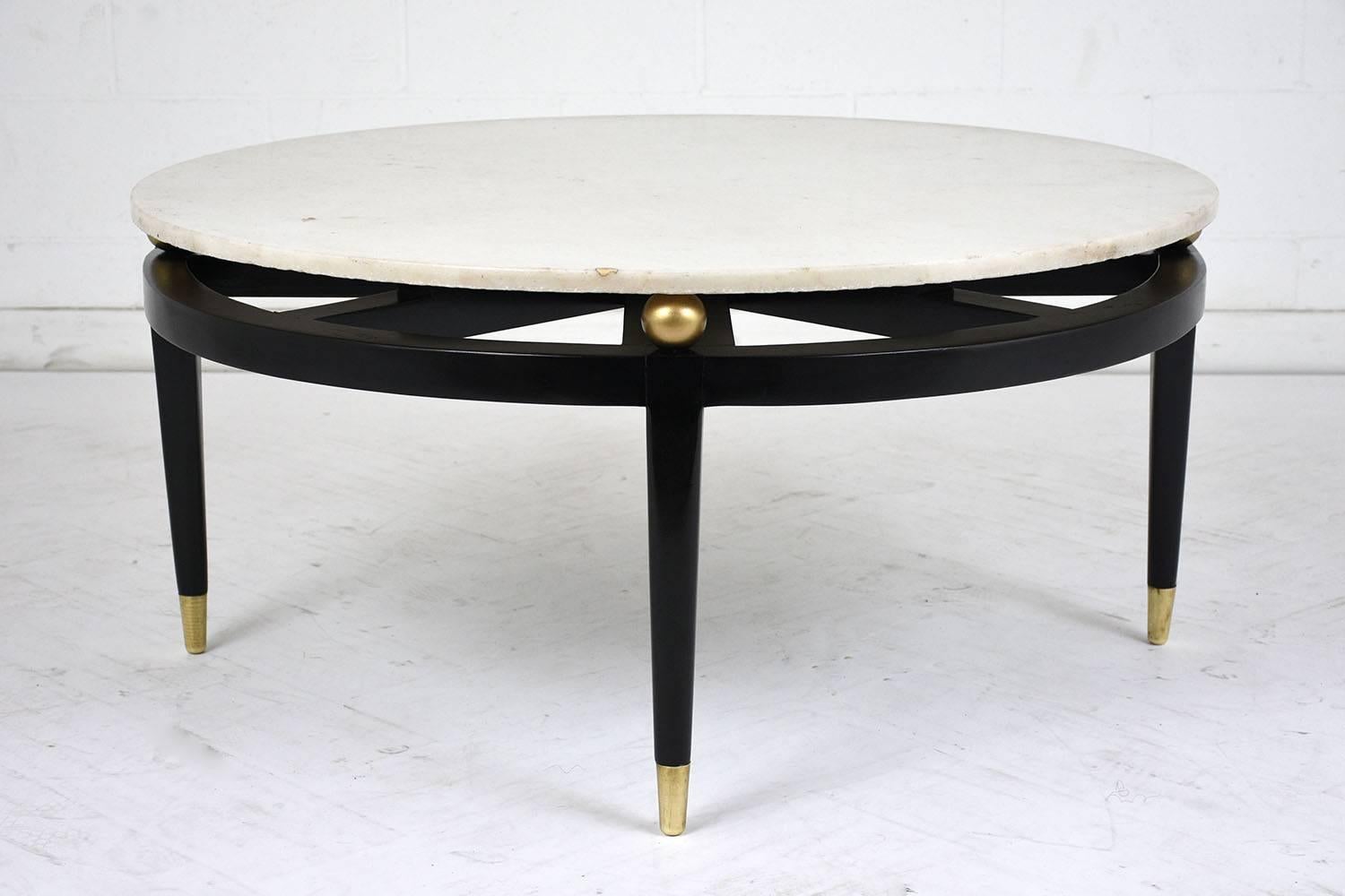 This 1960s Mid-Century Modern-style coffee table features a marble top with a wood base. The white marble top is cut in a circular pattern with a flat polish finish. The top is floating on top of the wood base and rests on a center axle with suction