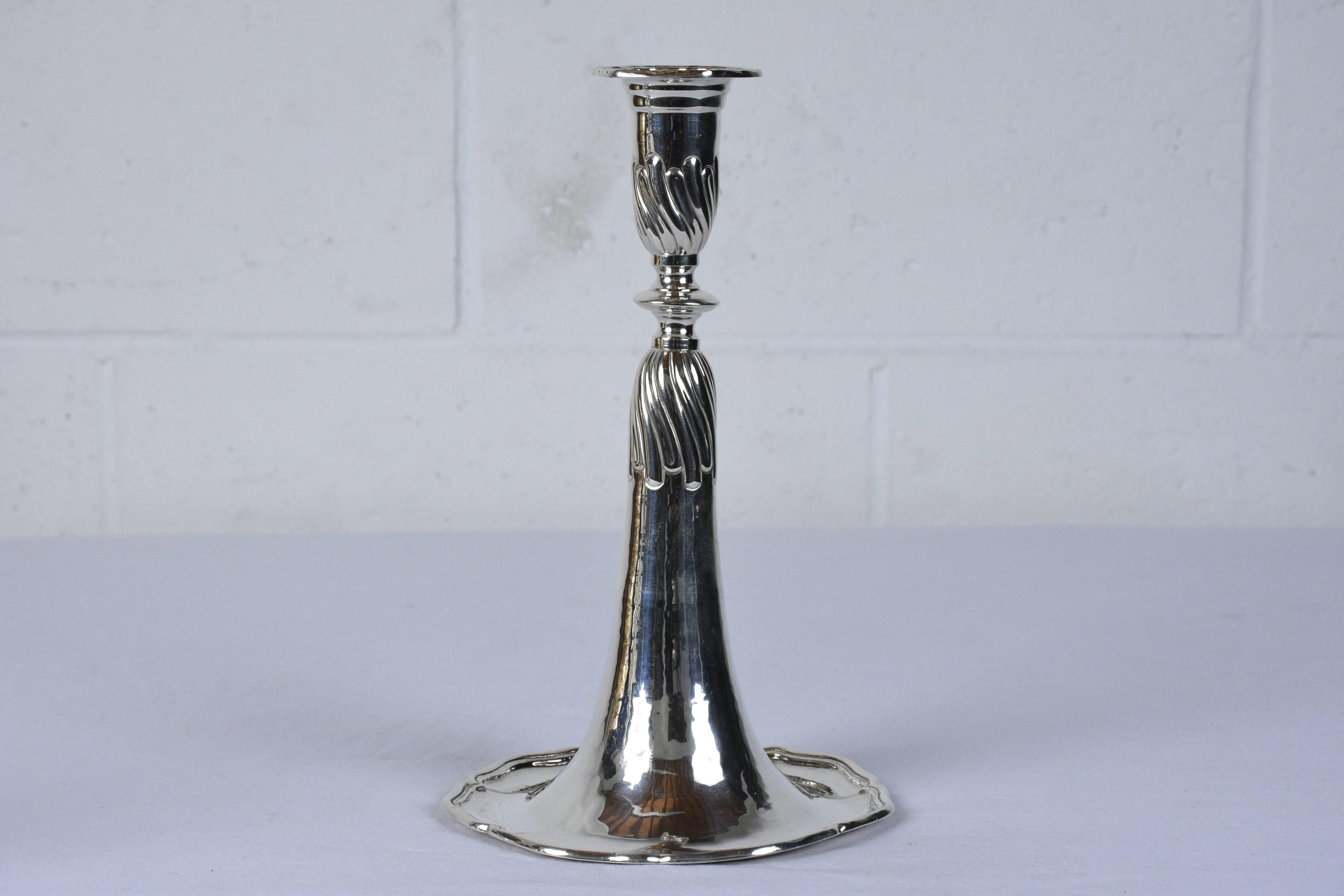 This pair of 1980's Turkish sterling sliver candle holders are stamped .925. The body of the candle holders feature a trumpet shape with decorative details. This pair of candle holder are sturdy, elegant, and ready to be used for years to come.