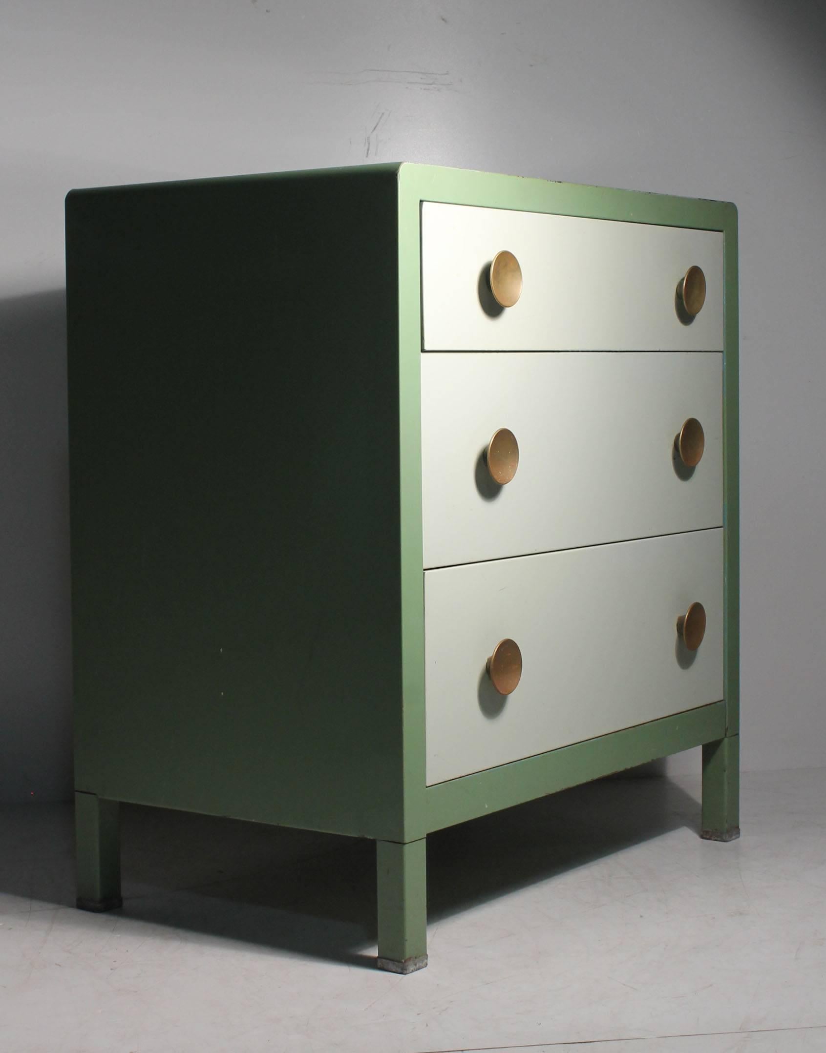 Norman Bel Geddes deco steel Industrial dresser or small buffet sideboard cabinet for a dining space. A nice early one for Simmons with label attached. Desirable smaller boutique size and proportions. Designers will brush steel these cabinets for an