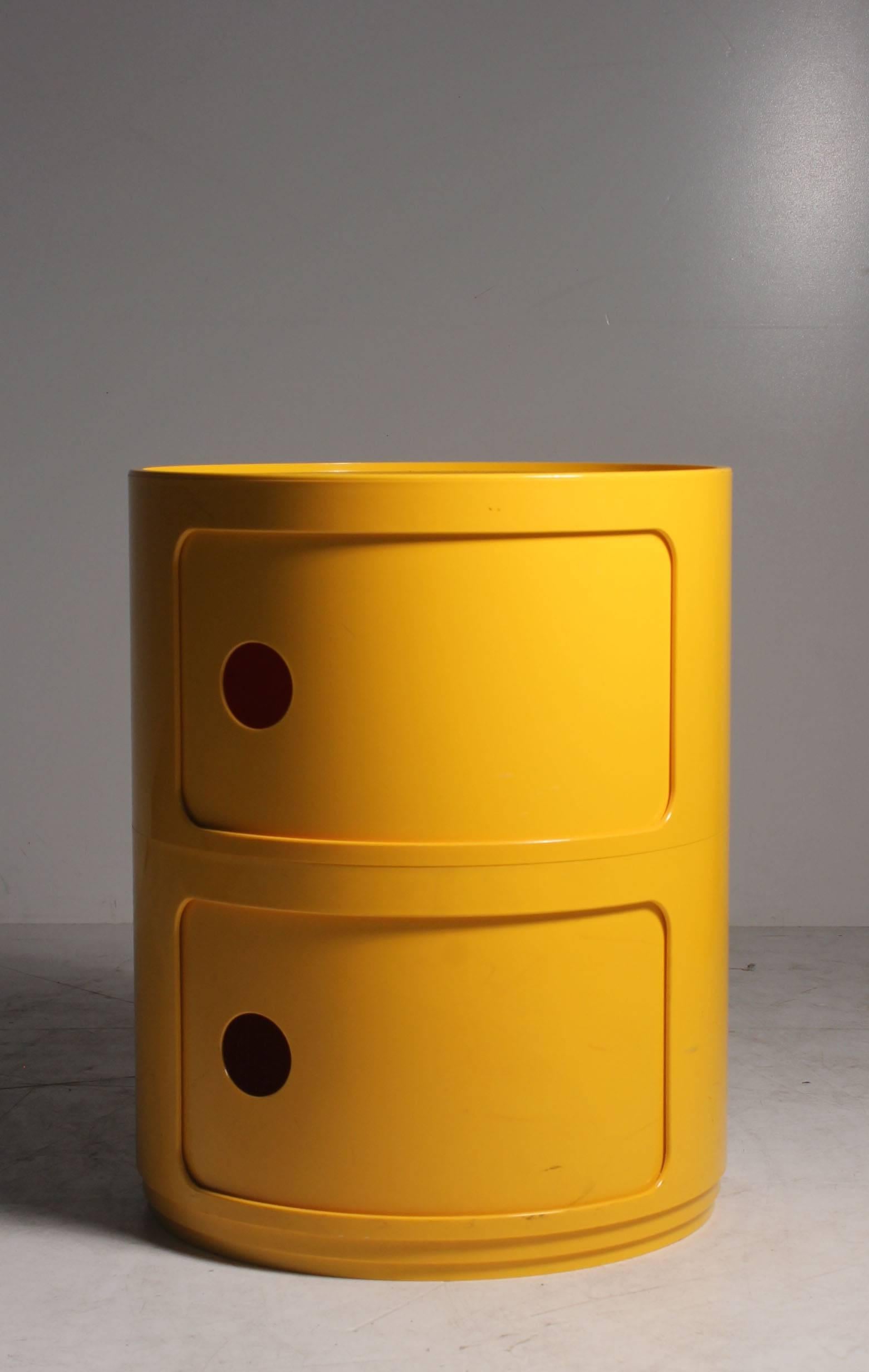 Pair of Anna Castelli Kartell yellow plastic stacking storage nightstands or end tables.
These can also be stacked on top of one another to be four units tall.
Space age or POP culture, 1970s-1980s.

Each nightstand is 15.5" tall.

Signed