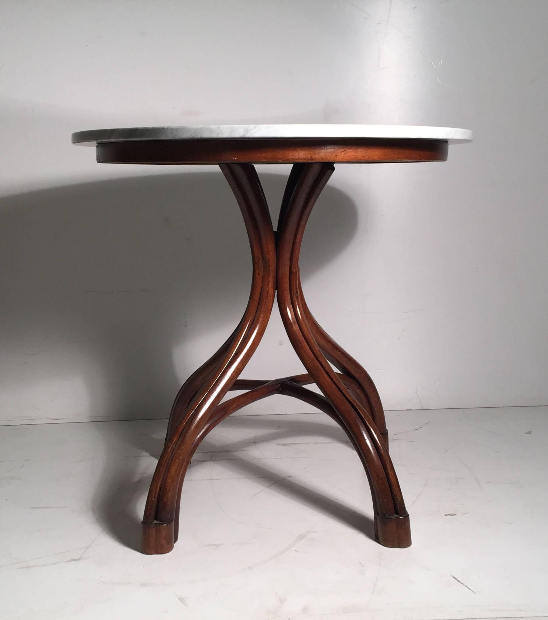 Beautiful vintage bentwood small cafe dining or dinette table. Also makes for a nice side table. We have another matching one listed if you desire a matching pair. This one was refinished at one time and includes a nice round marble top that works