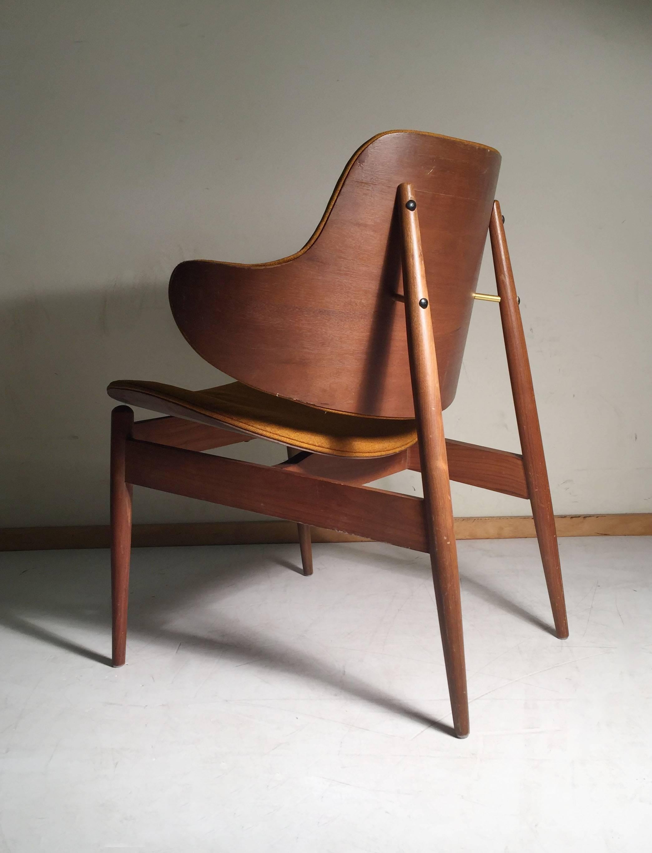 The most desirable form of the kodawood chairs. Clamshell back. Danish Modern, Kofod Larsen Adrian Pearsall style.

may need reupholstery.  fabric is loose as shown in photos and some dingy spots. Maybe will clean up but best to purchase with the