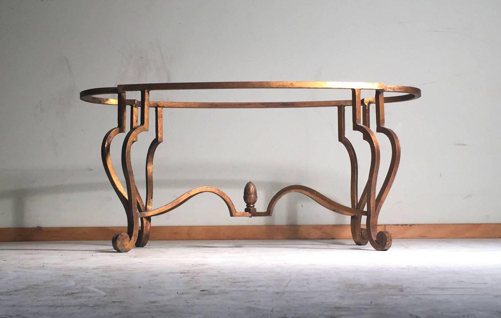 A nice decorative wrought iron coffee table of quality craftsmanship. In the manner of Maison Ramsay and Jean Charles Moreux. No marks or signatures. Possibly from France or Italy. A beautiful proportion and size on this table.

The top frame