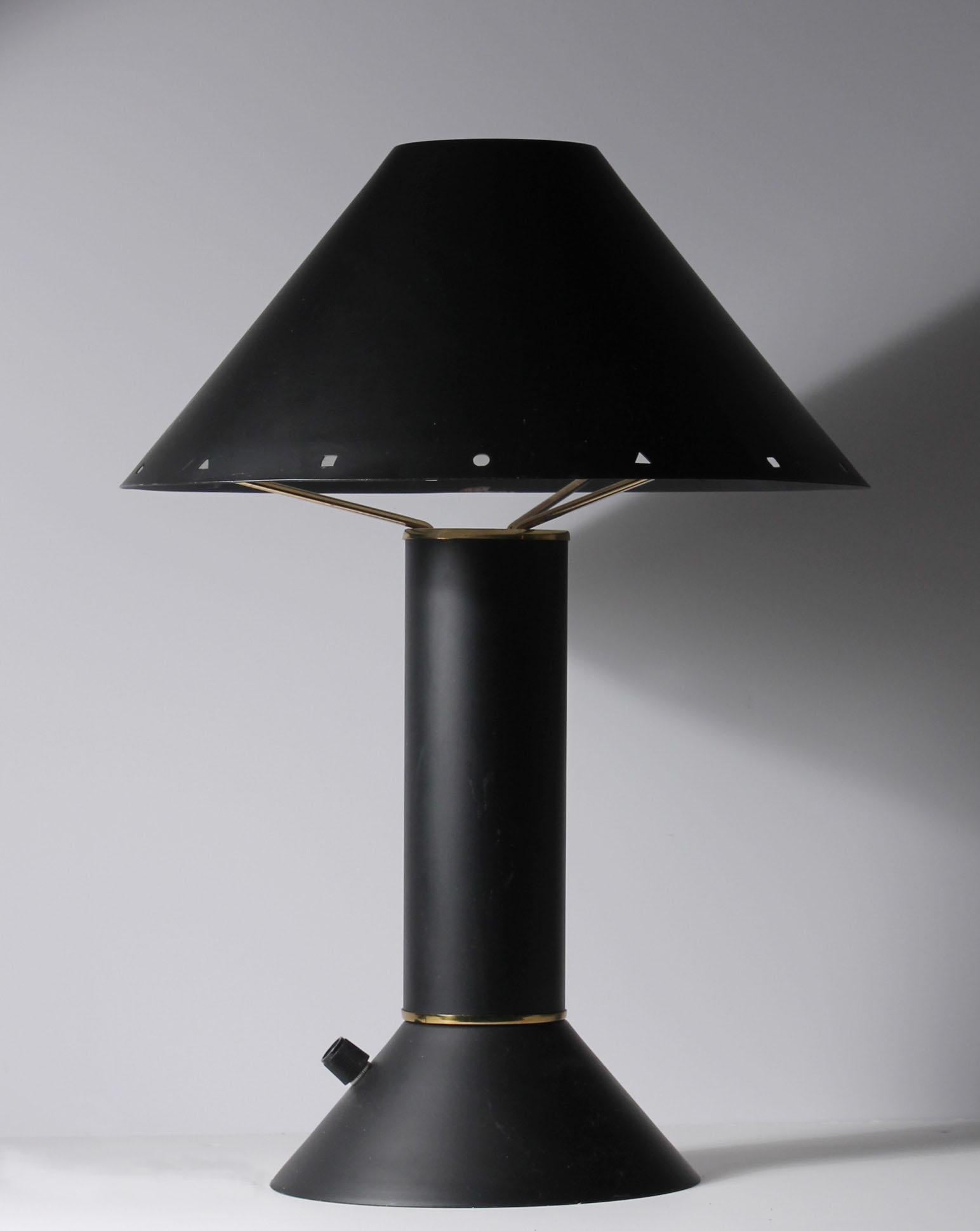 Pair of vintage Original black Ron Rezek table lamps. Original label attached on underside. This lamp form scarcely seen in black. Possibly a smaller production or custom.

Some light wear to the black finish. Please contact for details.
