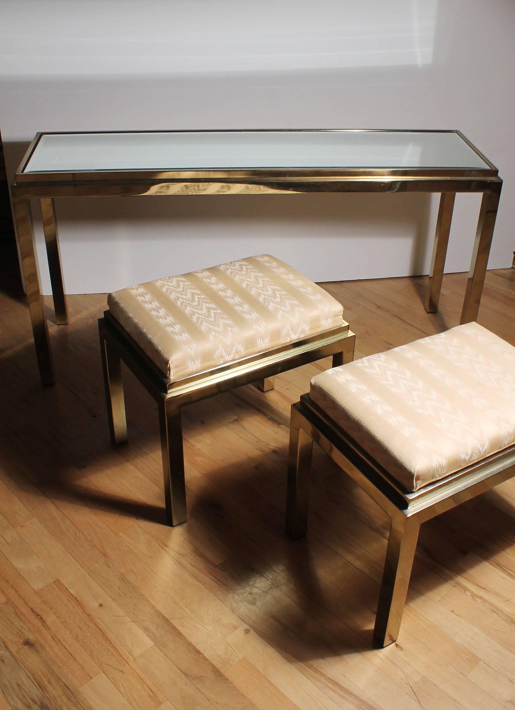Brass plated console with matching stools in style of Milo Baughman.
Mirrored top.