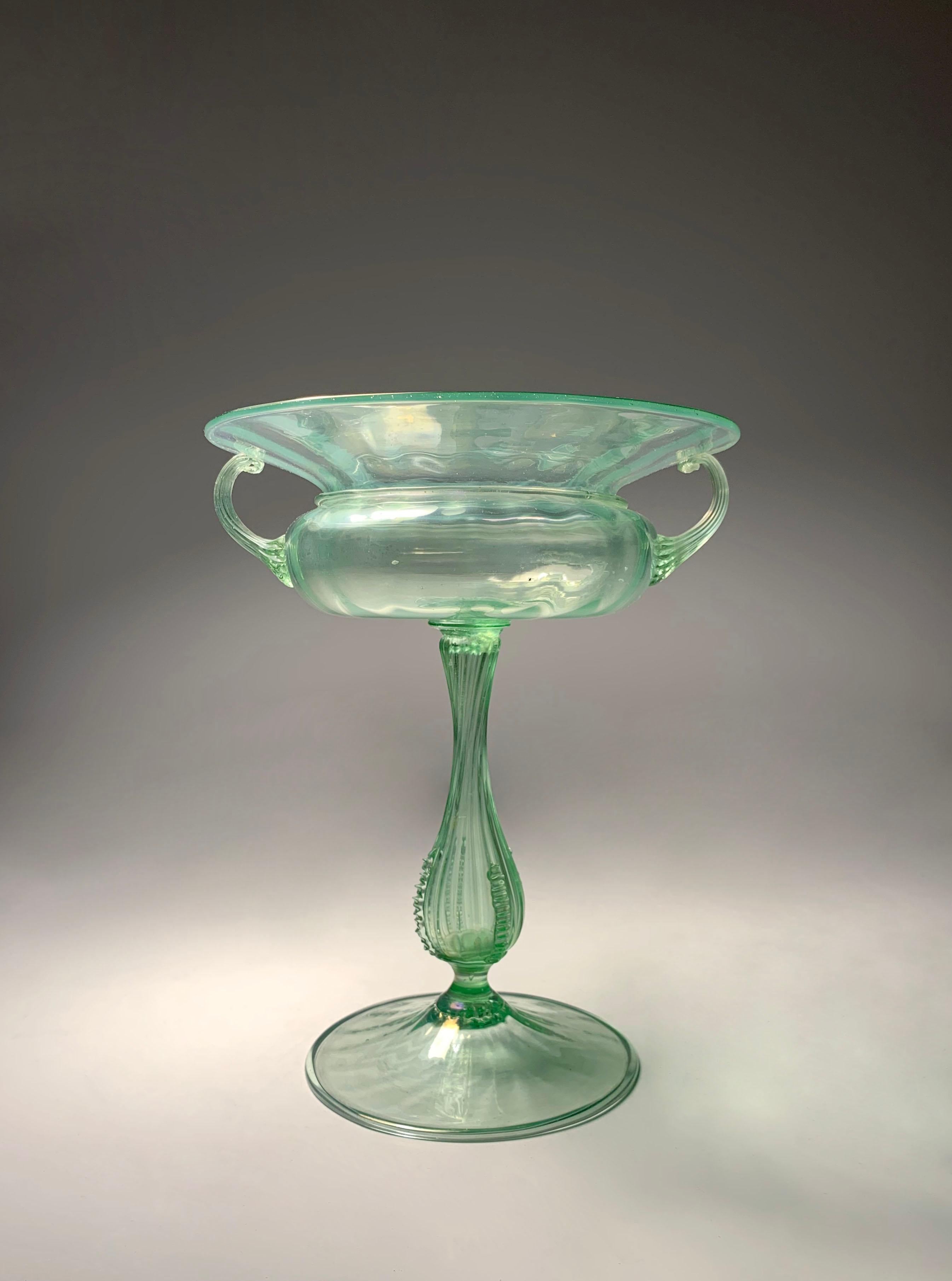 Delicate Large Murano Glass Centerpiece Compote by Salviati. A beautiful light green thin glass.  Uncertain to age. Believe it to be 1920s/30s. The item is as-is. At one point it appears the large bowl snapped off at the top of the stem where it had