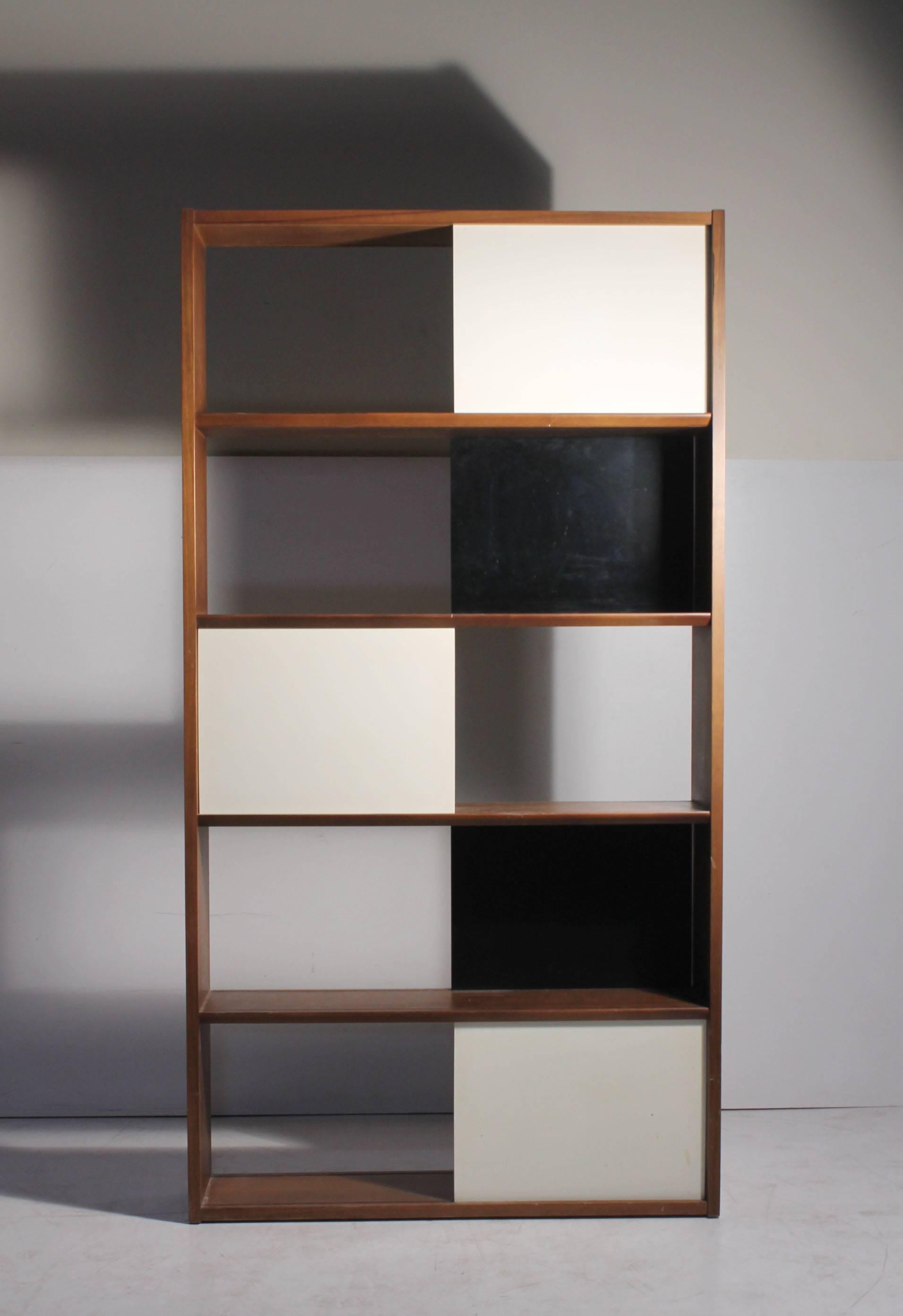 Evans Clark single book shelf Glenn of California. The use of the solid color panels is reminicent of work by Jean Prouve, Charles Eames and Milo Baughman.  Black and white panels slide side to side. The Shelf can be oriented in any direction. There