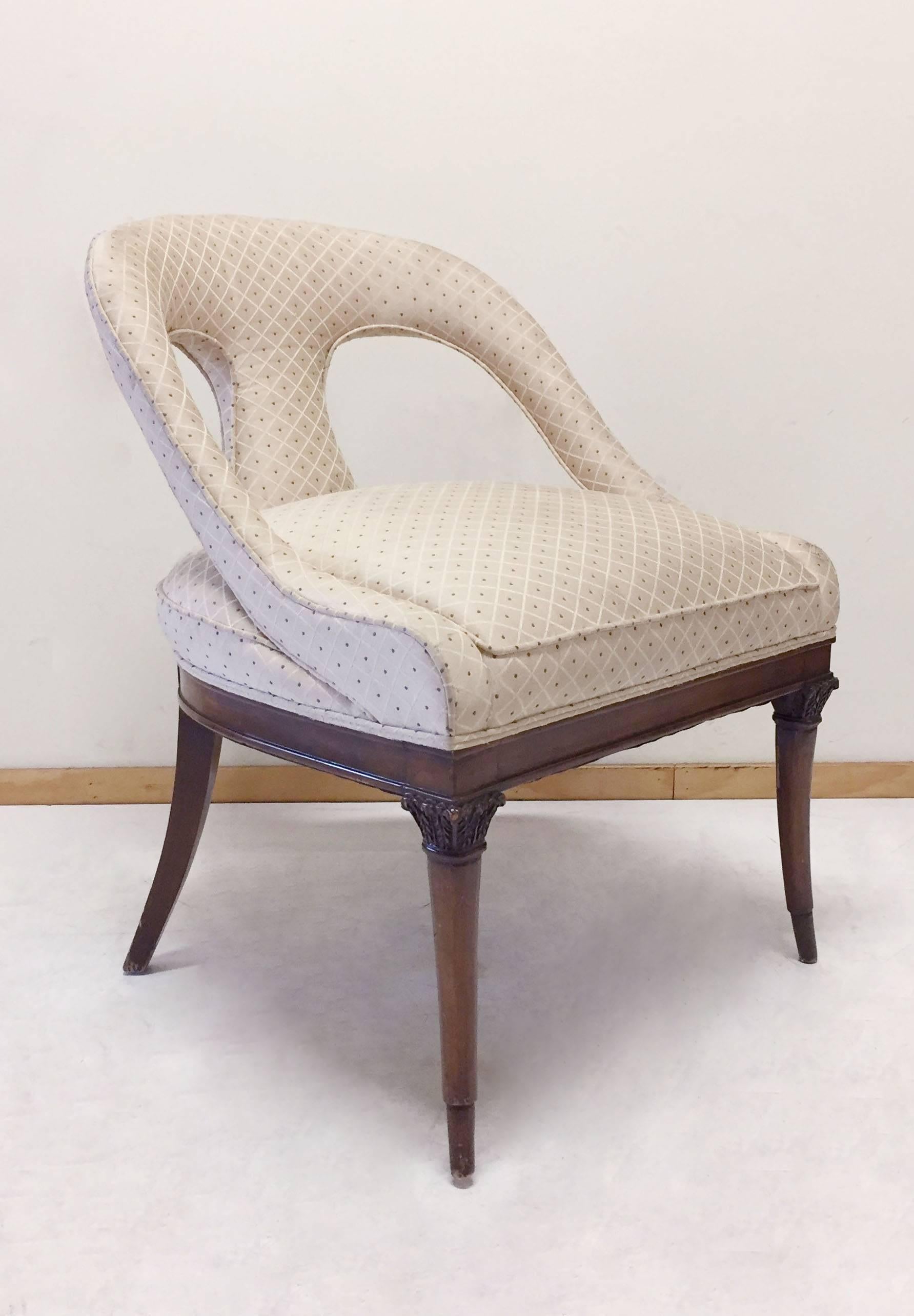 A designer side chair in the manner of Robsjohn Gibbings. 
Nice capital form integration detail to legs.

These really need reupholstery. I have three in total available. So priced per chair. 
Some wear to the wood finish.

One chair available at
