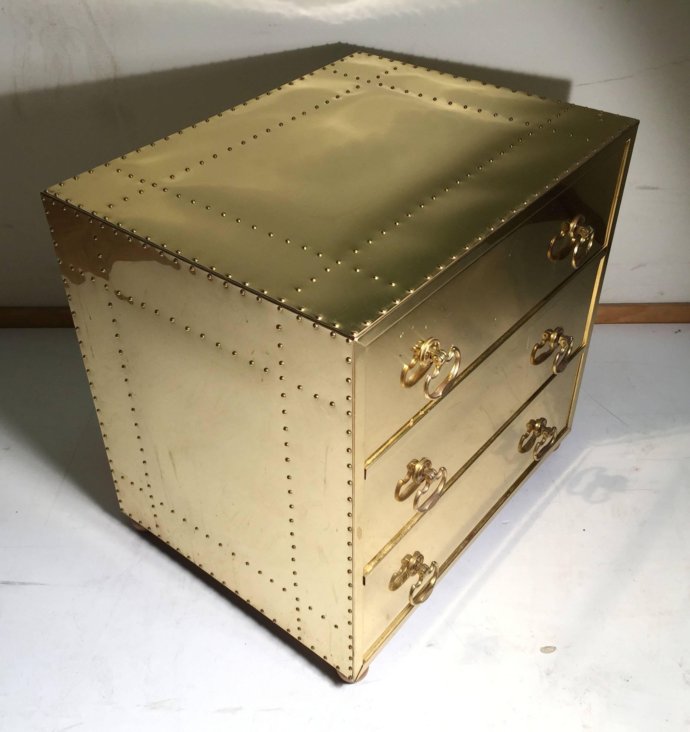 Brass clad or riveted chest attributed / in the style of Sarreid. Purchased from the Merchandise Mart in Chicago in the 1980/90's. There are no lables intact at this time. Compliments Mastercraft Brass furniture very well.

There are some light