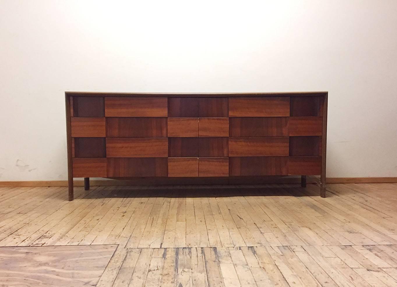 Great opportunity to acquire an Exceptional dresser credenza by Edmond Spence. Eight drawers in total. Edmond Spence was an American designer producing a fair amount of his work in Sweden. 

Some Wear scratches to the original finish. 
rear back leg