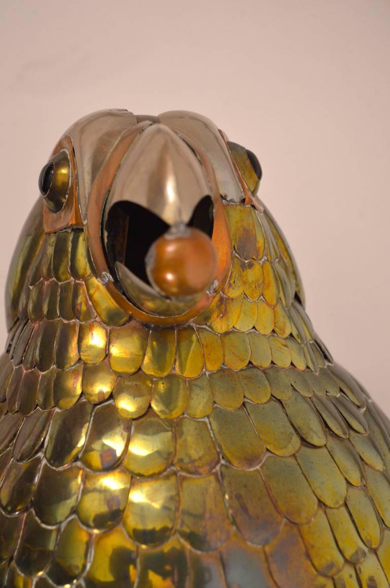 Excellent original condition, copper and brass parrot on swing by Sergio Bustamante.