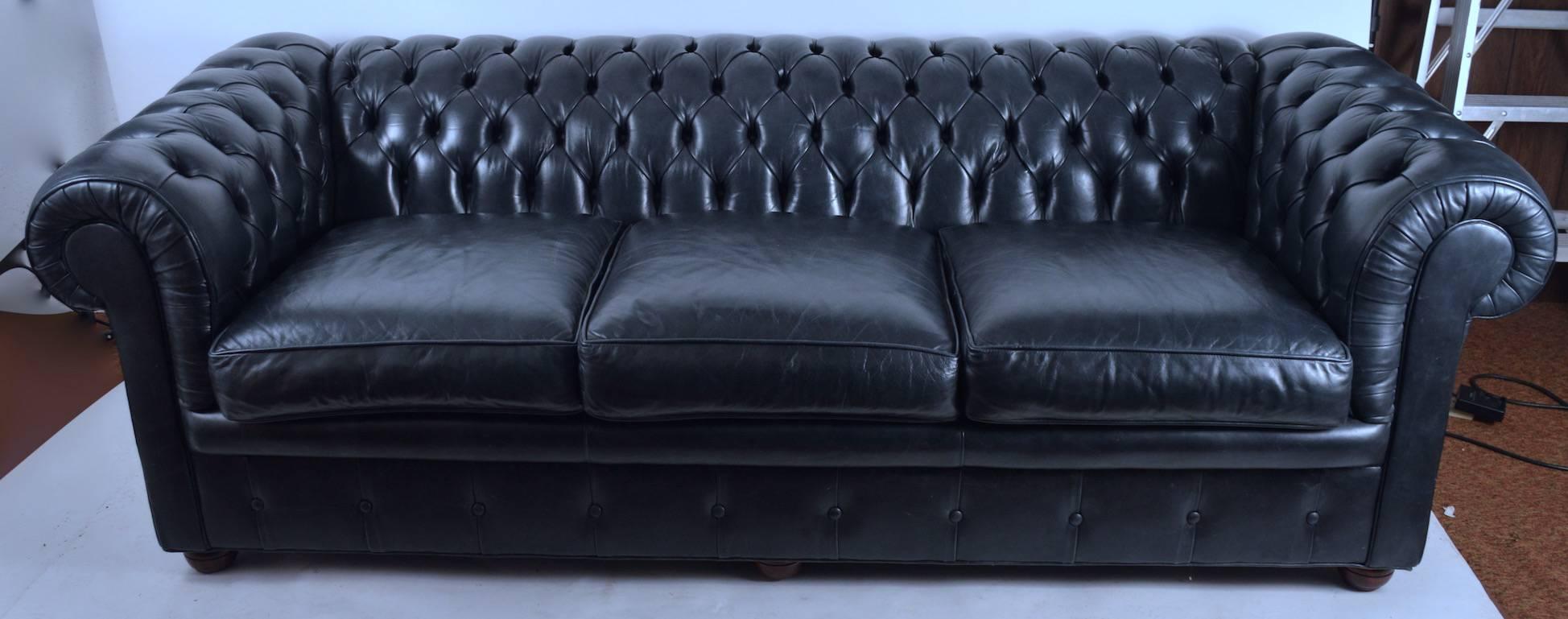 Midnight blue tufted leather Chesterfield sofa by 