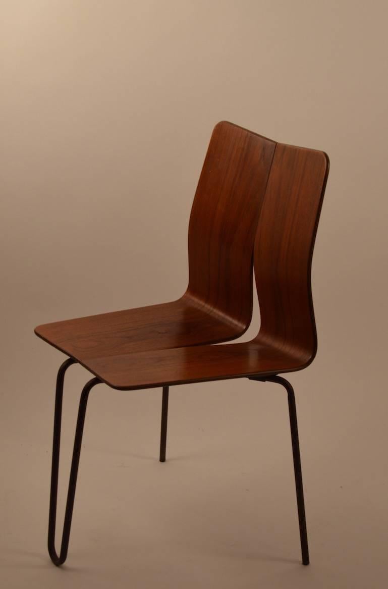 Unusual and hard to find form, continuous bentwood back and seat, on bent iron rod leg. Chair bears the branded mark 