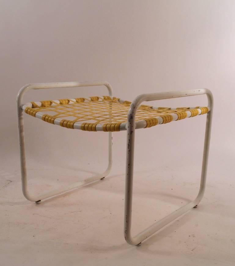 Aluminum frames, plastic webbing. Vintage lawn furniture by Brown Jordan. Normal cosmetic wear consistent with age. Chair dimensions in listing - ottoman as follows 21