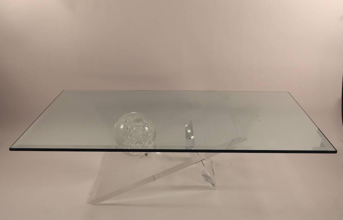 Lucite base with large ball form, supports thick bevelled glass. Measures: top (1