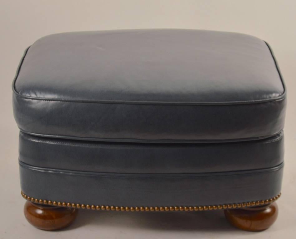 Rectangular leather footrest, pouf by Schafer Brothers. Gunmetal leather with brass nailhead decorative trim.