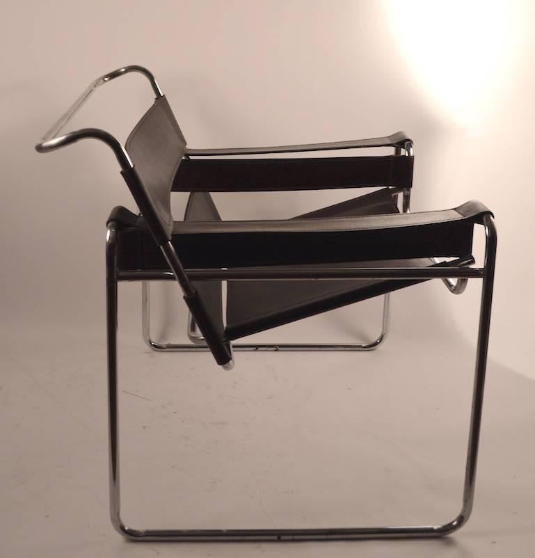 Nice 1960s-1970s vintage Wassily chairs with chrome frames and well patinated dark brown leather seats, backs and armrests.
 Unmarked, probably Italian made, top quality construction and stylish. Dark chocolate tone leather against bright chrome