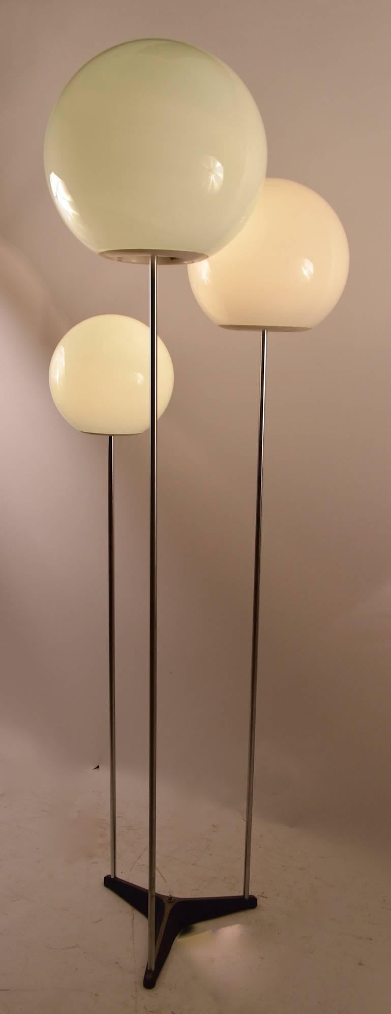 Three light ball top floor lamp, each globe is descending in height and size (12