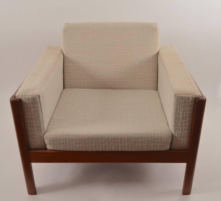 Sophisticated design, great quality construction, period Danish modern teak frame club chair. The cushions are in good condition showing only light cosmetic wear, normal and consistent with use. Arm height 22.5