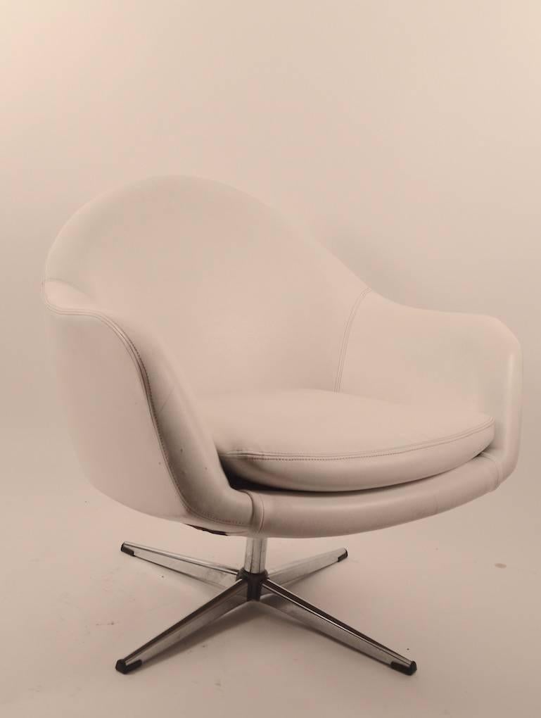 White vinyl swivel pod chair by 