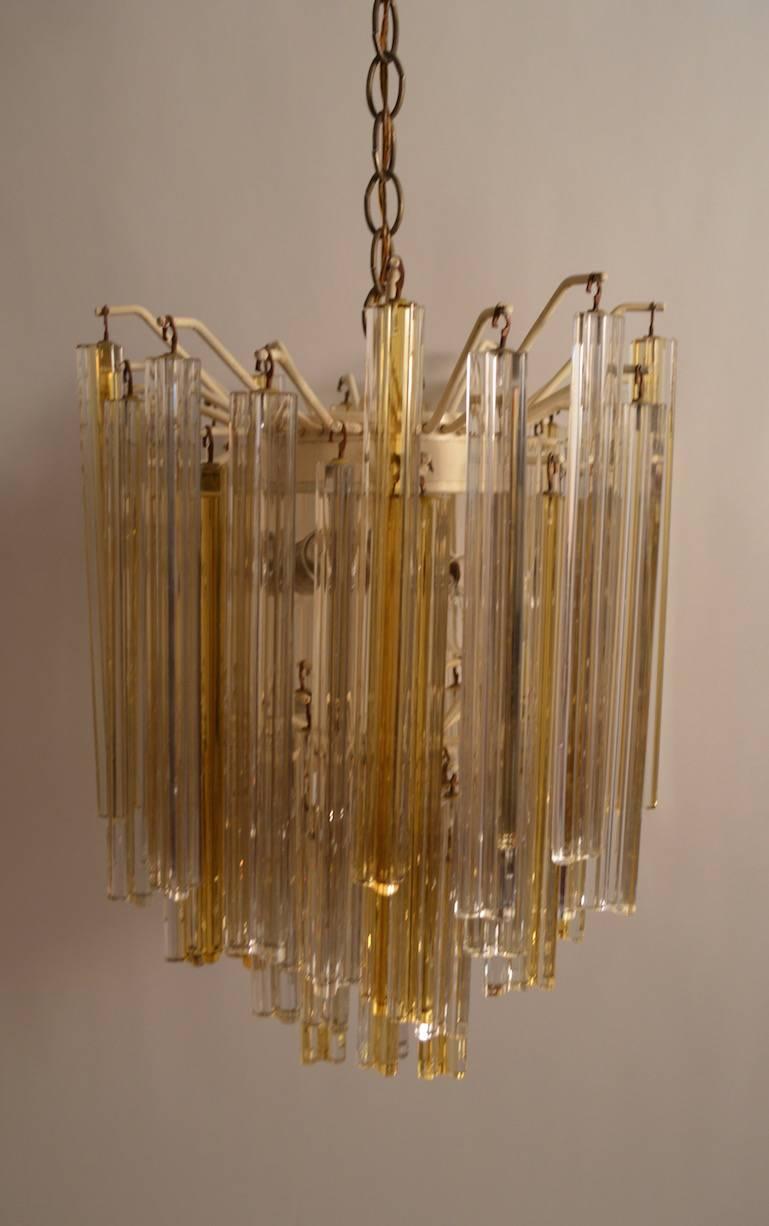 Vintage Venini glass prism chandelier with two-tone amber and clear drops.
In original, working and complete condition. The drops come in two lengths, the longer 15