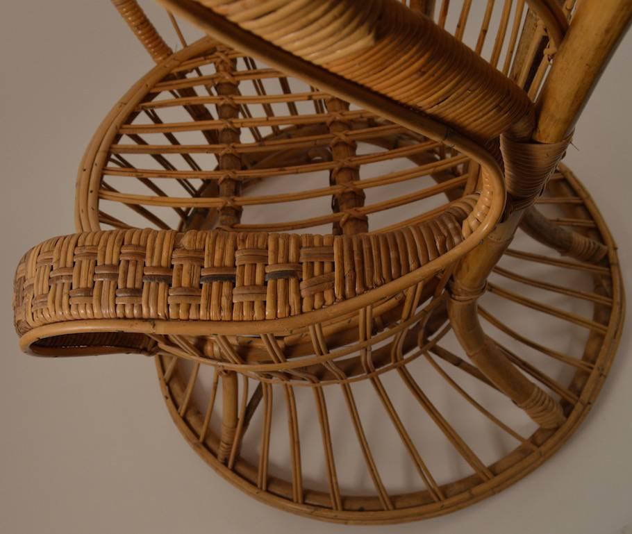 Iconic fan back wicker peacock chair, attributed to Ponti for Vittorio Bonacina & Co. Very good original condition showing only light signs of use, normal and consistent with age.
These chairs are by Lio Carminati and were made during the late