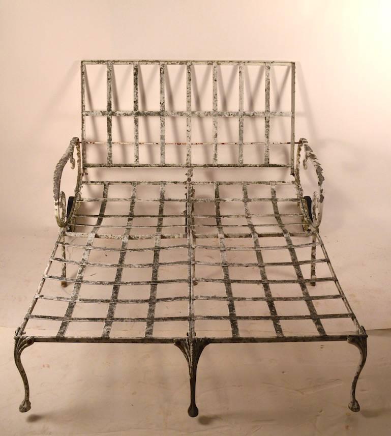Hard to find double wide patio, poolside and garden chaise in cast aluminum by Molla. Offered here is one of a pair we have listed. The back support is adjustable in height to assure comfort, comes with cushions shown or reupholster to taste. This