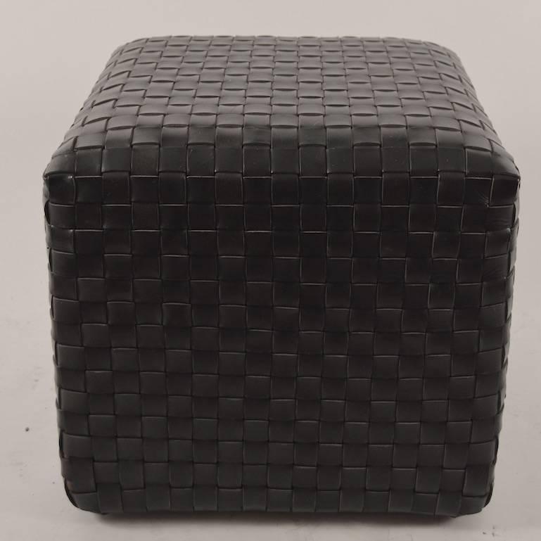 Cube form woven leather strap pouf, stool or ottomans. Both in excellent original condition, both marked 