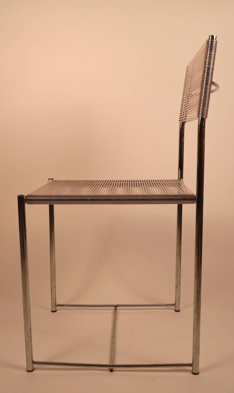 Great set of four fly Line chairs designed by Giandomenico Belotti. This set is in chrome with clear plastic wrapping. Hard to find a set of four still intact. Great 1970s Italian design, stylish, chic, and comfortable.